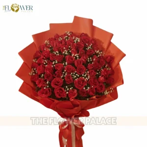 Classic hand-tied bouquet of fresh red roses in premium black wrapping for delivery in Islamabad.