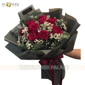 Premium red rose bouquet with baby's breath fillers and elegant dual-tone wrapping for delivery in Islamabad